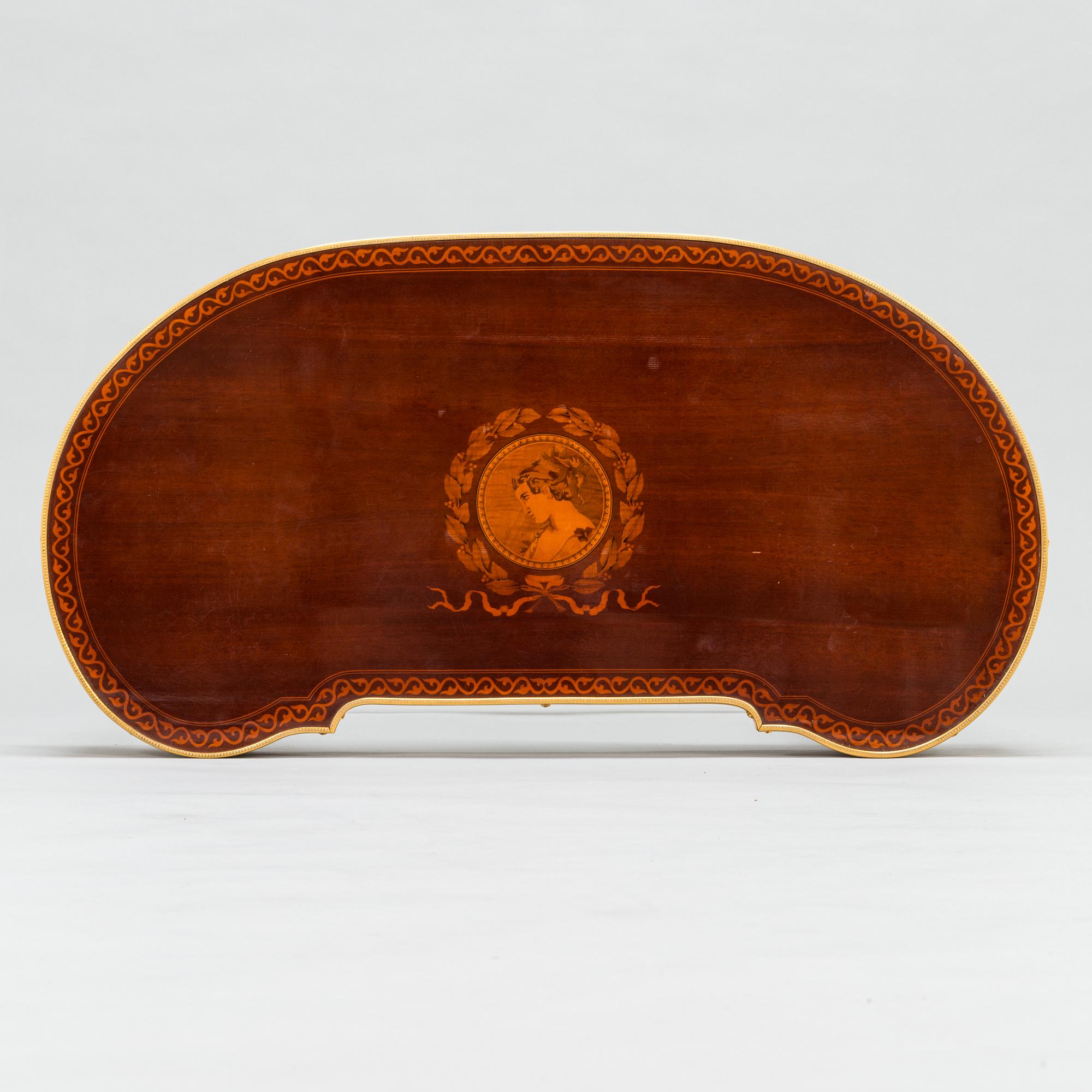 A Directoire style marquetry table from around year 1900.