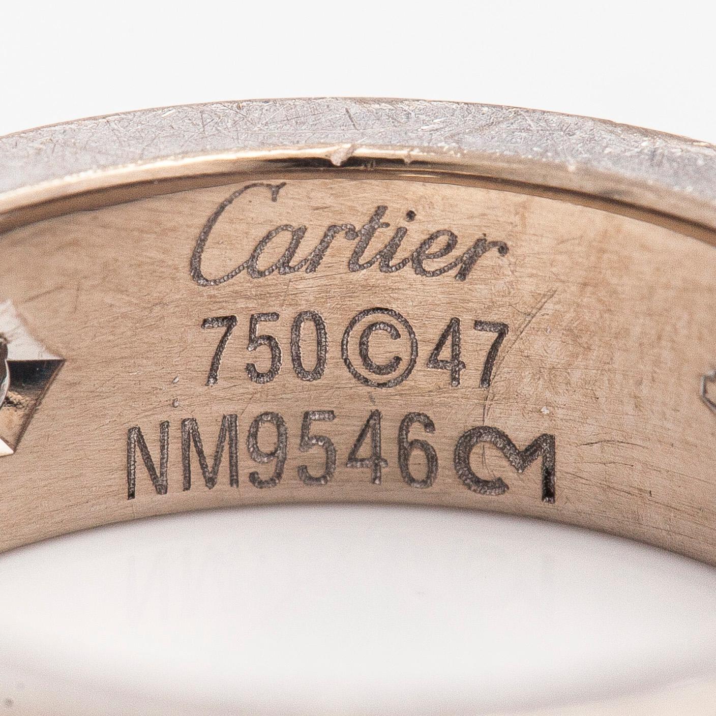 Cartier, an 18K white gold 'Love' ring with three brilliant-cut diamonds.