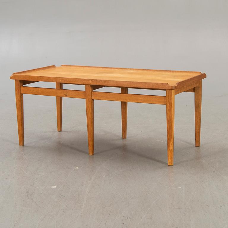 A 1960s oak coffee table.