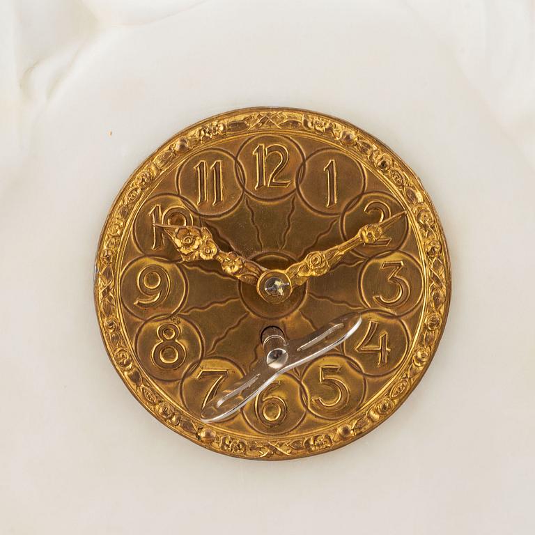 An alabaster mantle clock from the second half of the 19th-century.