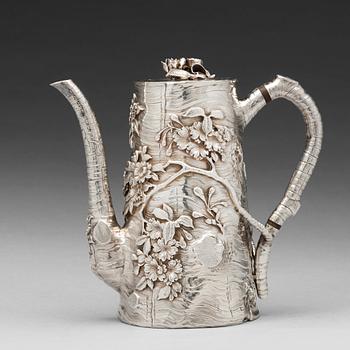 566. A Japanese silver coffee pot with cover, early 20th Century.