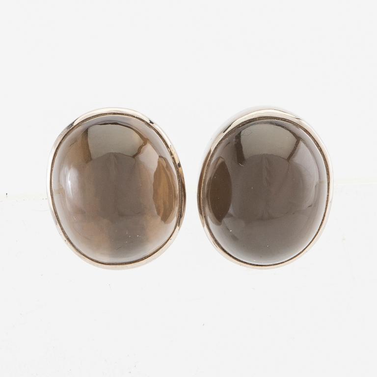 Earrings, a pair of 18K white gold with cabochon-cut grey moonstones, Gunnar Fahlström, Stockholm 1955.