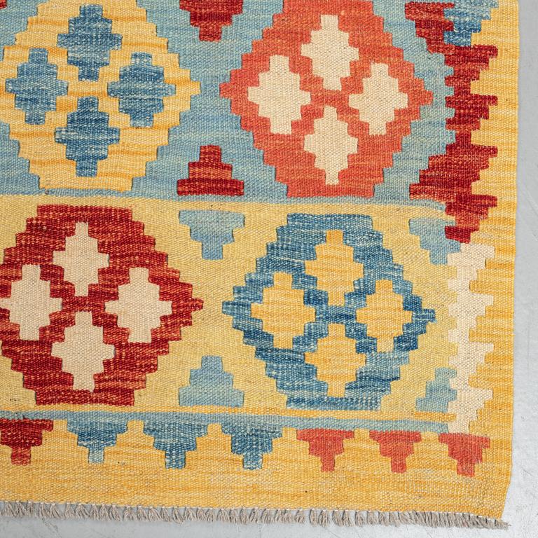 A carpet, kilim, ca 244 x 188 cm.