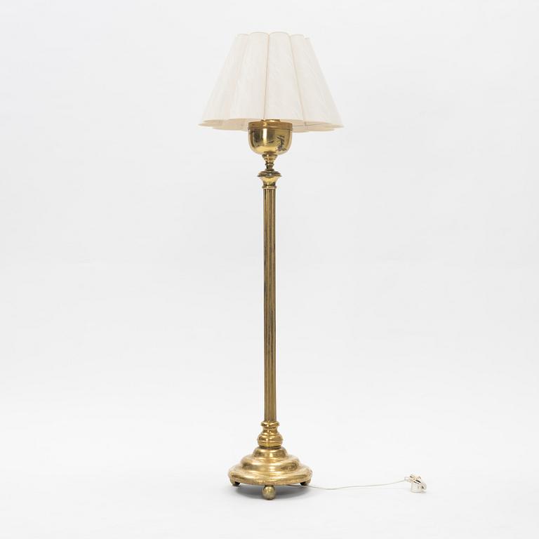 A brass floor lamp.