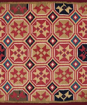 A CARRIAGE CUSHION, double-interlocked tapestry, "Stjärnmönster", ca 43,5-44,5 x 94-95 cm, Scania (Sweden).
