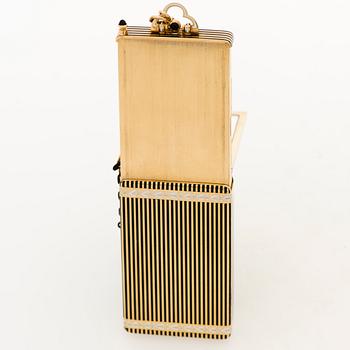 A Cartier Art Deco Vanity Case/Minaudière in 18K gold, black enamel and onyx.