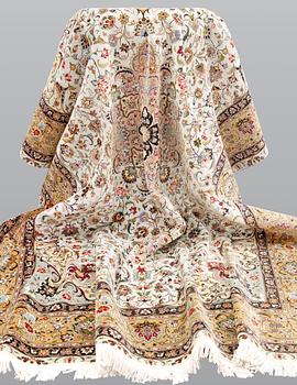 A part silk Tabriz carpet, so-called 50 Raj, approx. 348 x 252 cm.