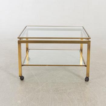 A brass and glass top coffee table.