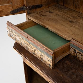 A Swedish Dalecarlian folk art cabinet dated 1808.