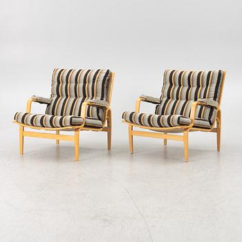 Bruno Mathsson, a pair of "ingrid" armchairs, Dux, Sweden, second half of the 20th century.