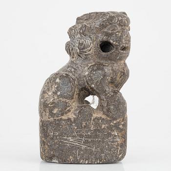 A stone scroll weight/sculpture of a buddhist lion, China, presumably Qing dynasty (1664-1912).