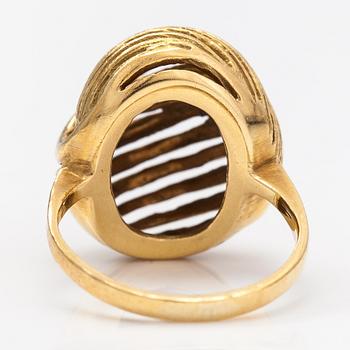 A pair of earrings and a ring made of 14K gold.