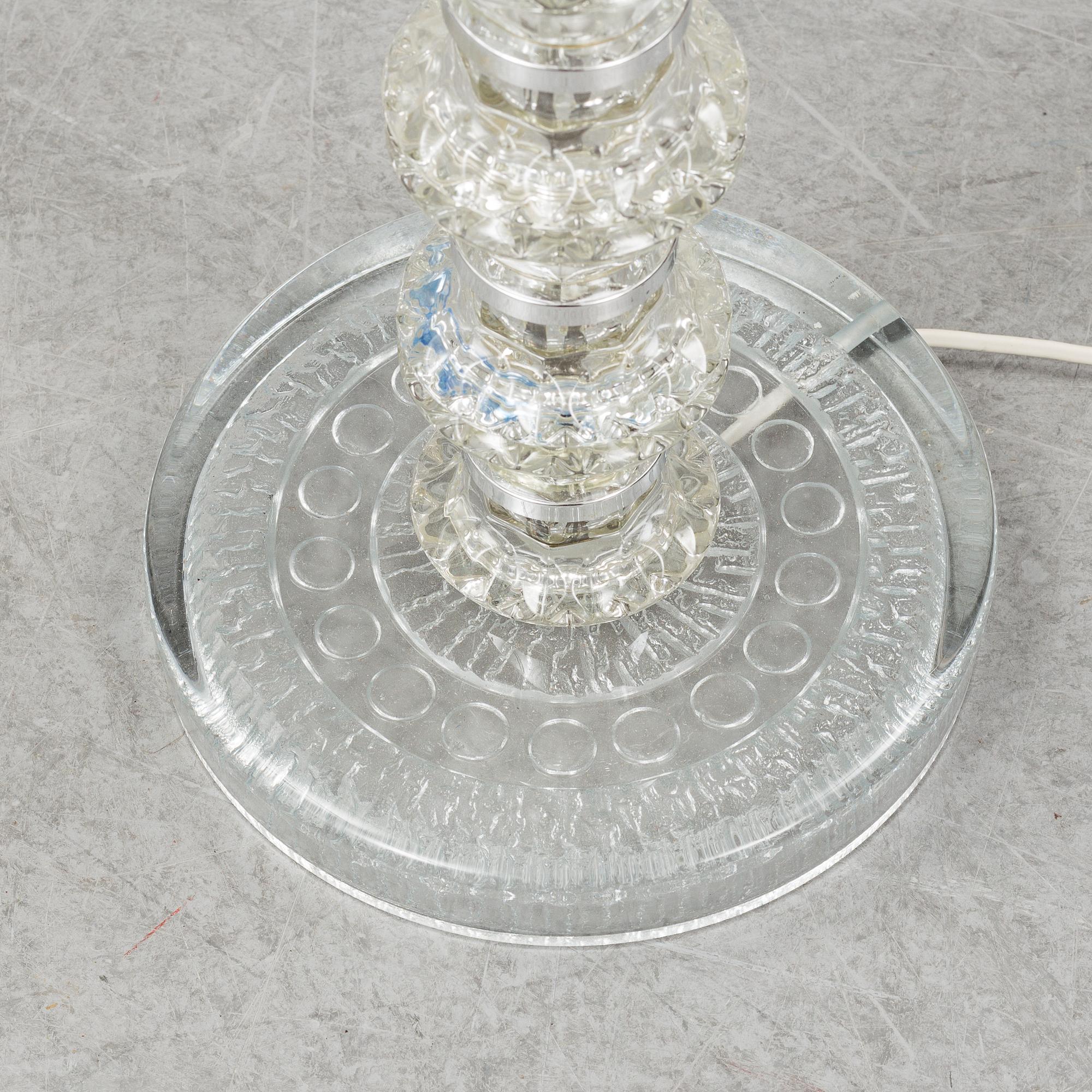 A glass floor lamp.
