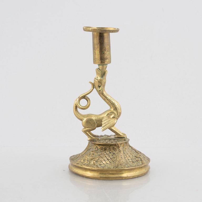 A rococo-style brass candlestick, 18th century and later.