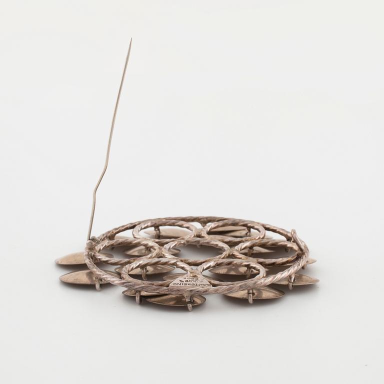 FRANK JUHLS, Kautokeino, Norway, a brooch.