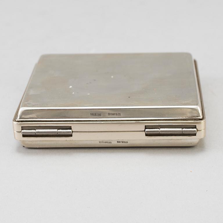 A silver calculator by Tiffany's and cuff link box in silver H.V.P & Co Birmingham 1887.