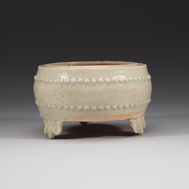 A pale celadon glazed tripod censer, presumably Yuan dynasty (1280-1367).