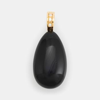 415. An 18K gold and onyx Acchinelli pendant set with round brilliant-cut diamonds.