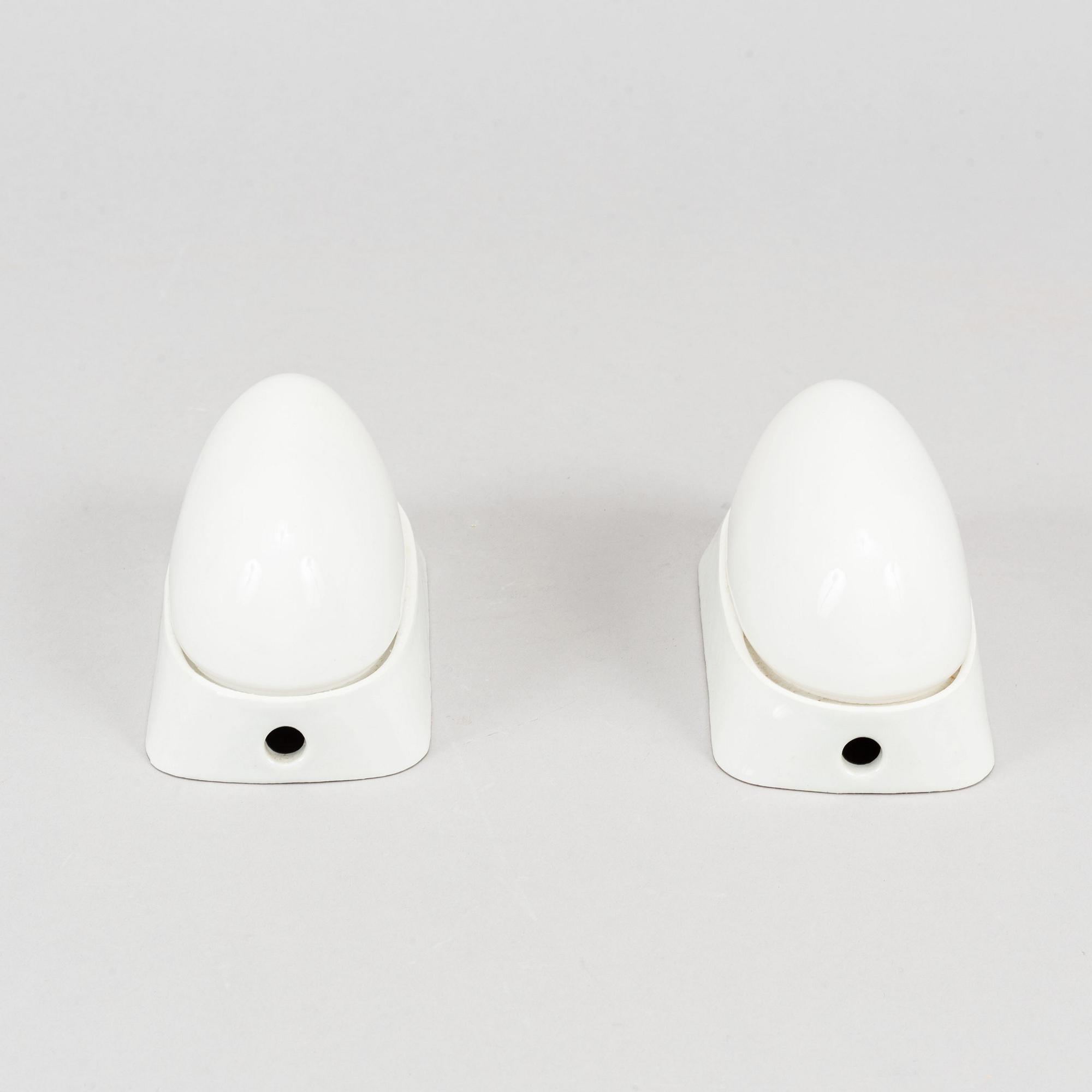 Wilhelm Wagenfeld, a set of three glass and ceramic bathroom lights, Lindner Keramik, Bamberg.