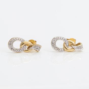 A pair of 14K gold earrings with diamonds ca. 0.01 ct in total.