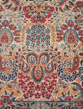 A carpet, a semi-antique Kerman, ca 375-379,5 x 268-271 cm.