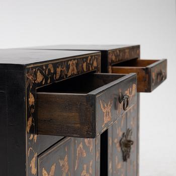 A pair of bedside tables/cabinets, China, 20th century.