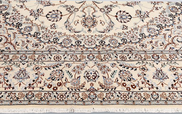 A Nain part-silk carpet, 395 x 293 cm.