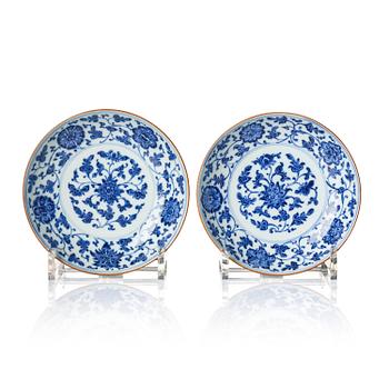 1324. A pair of blue and white floral dishes, Qing dynasty, with Qianlong mark and of the period (1736-95).