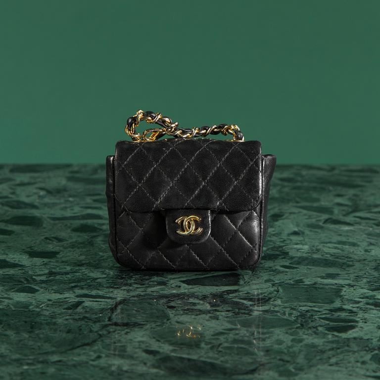 Belt with mini flap-bag by Chanel.