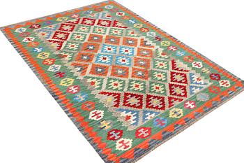 A Kilim rug, c. 243 x 175 cm.