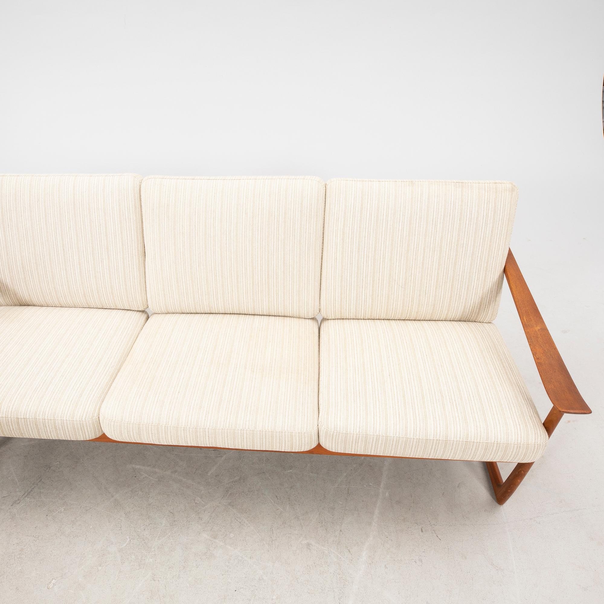 Peter Hvidt & Orla Mølgaard Nielsen, a teak sofa and armchair "Slädes" France & Daverkosen, designed in 1961.