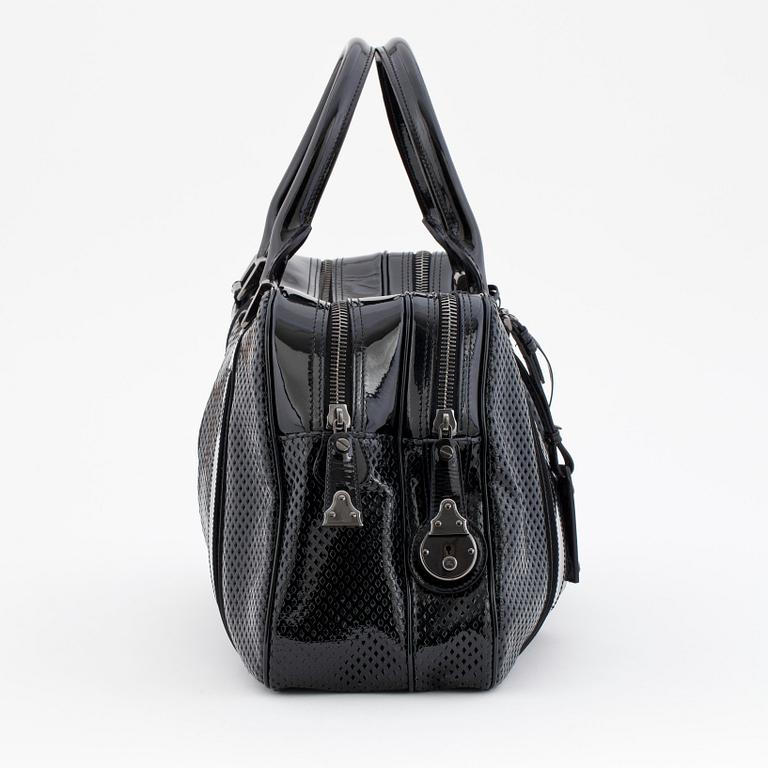 BURBERRY, a black patent leather bag.