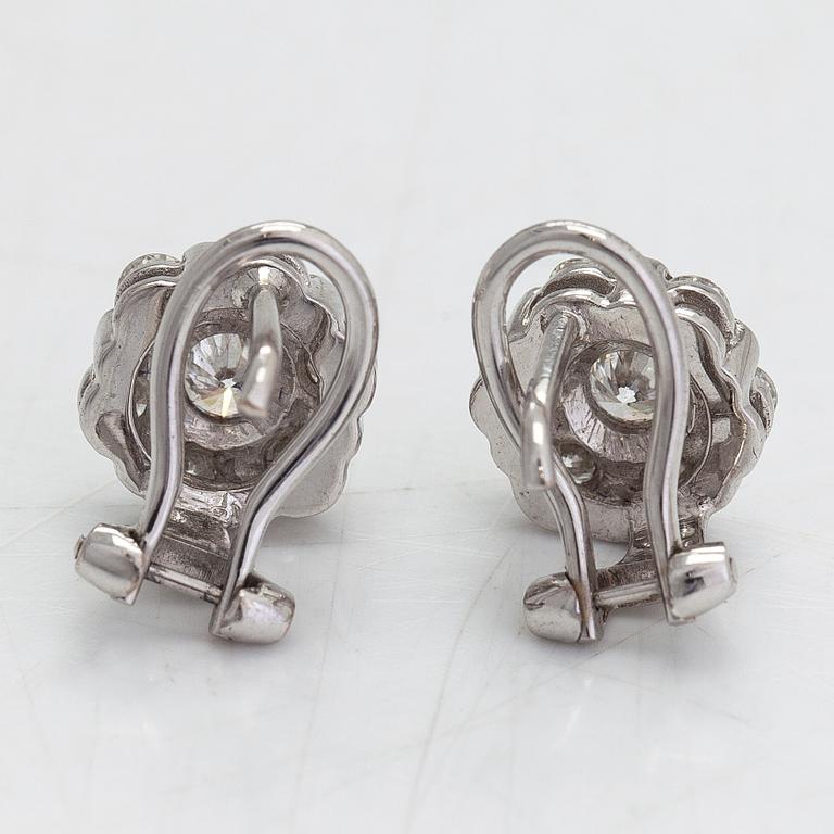 A pair of 18K white gold earrings, with diamonds totalling approximately 0.64 ct.