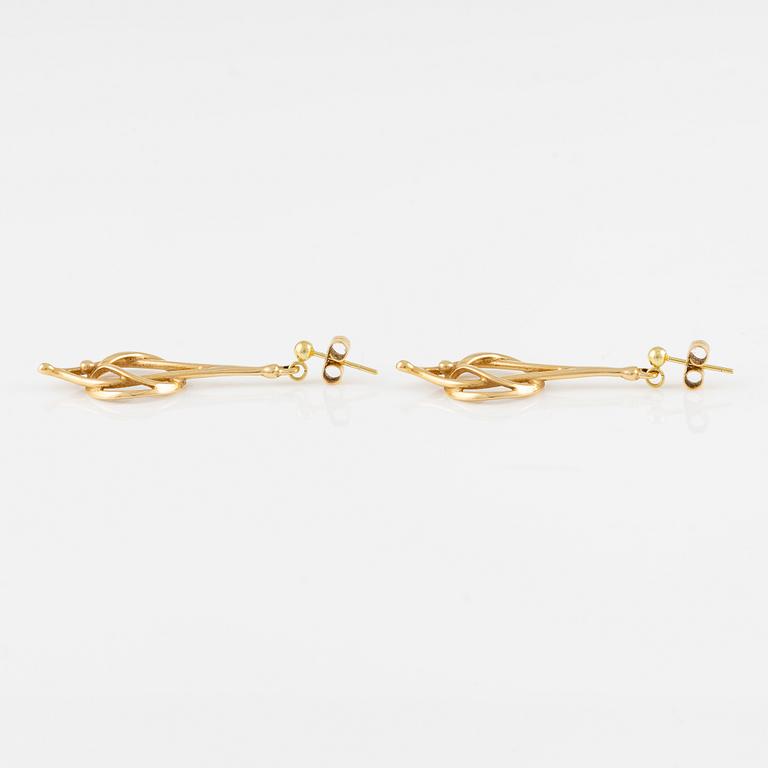 A pair of 18K gold earrings.