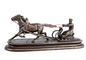 A SCULPTURE, Man in a horse sleigh.