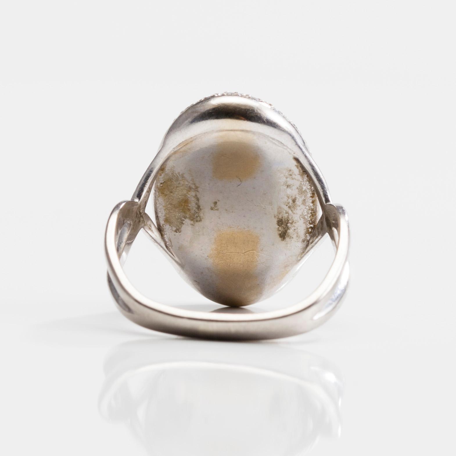 RING, 18K guld, opal 0,25 ct, diamanter. 1980-tal. Vikt 7,4 g.