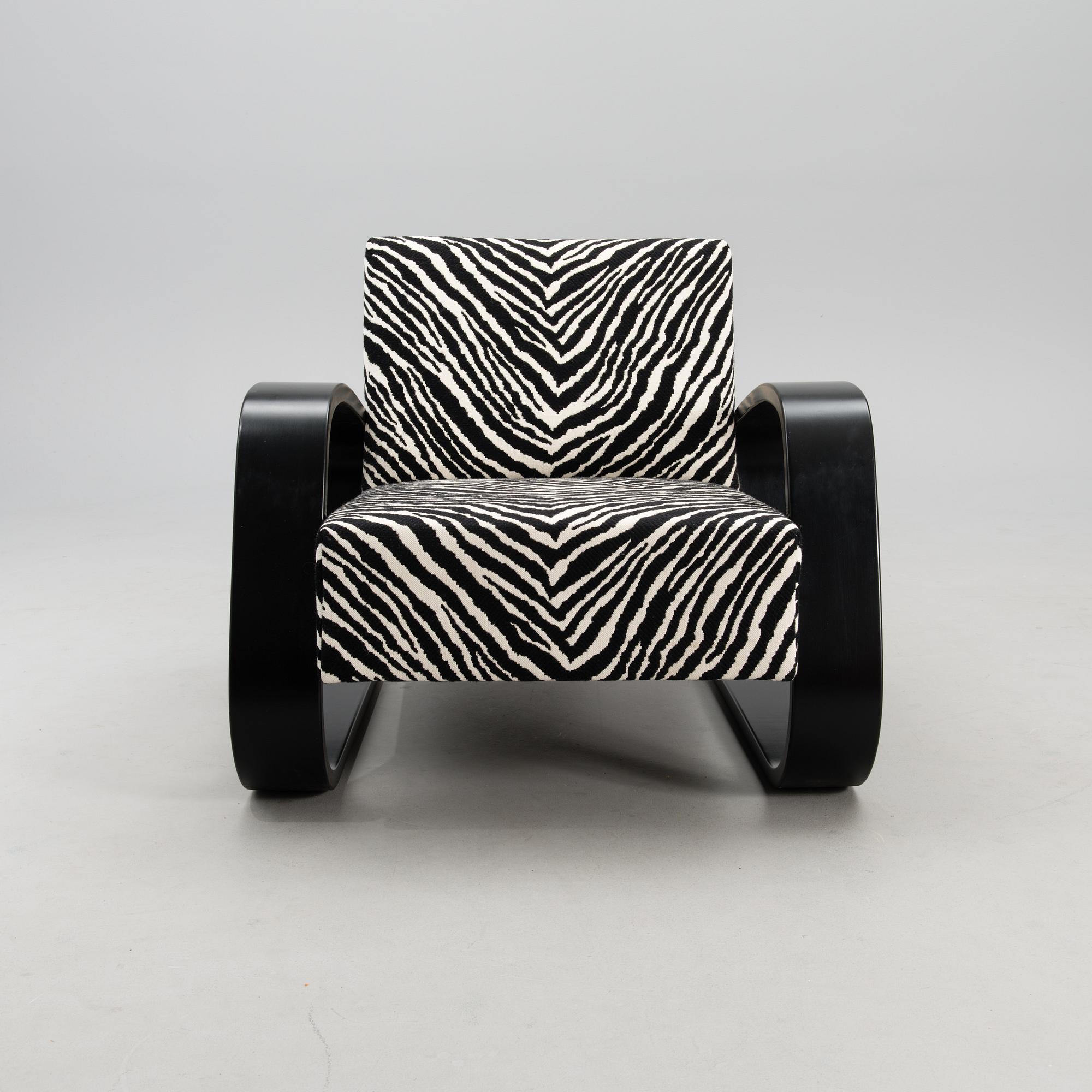 An armchair no 400, designed in 1936.