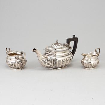 A silver teapot, creamer and sugar bowl, S Glass, Birmingham 1908.