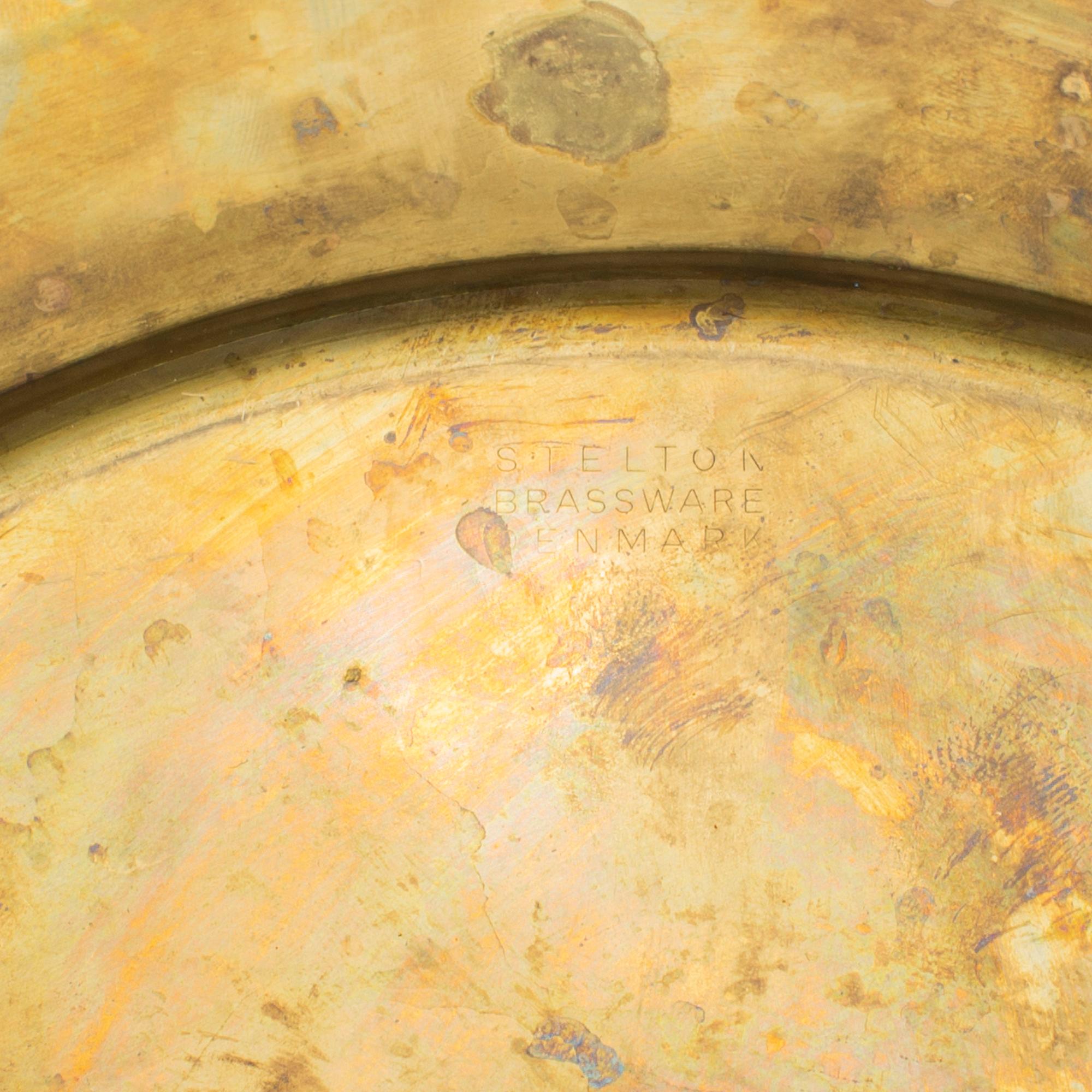 12 brass plates by Stelton, Denmark, second half of the 20th century.