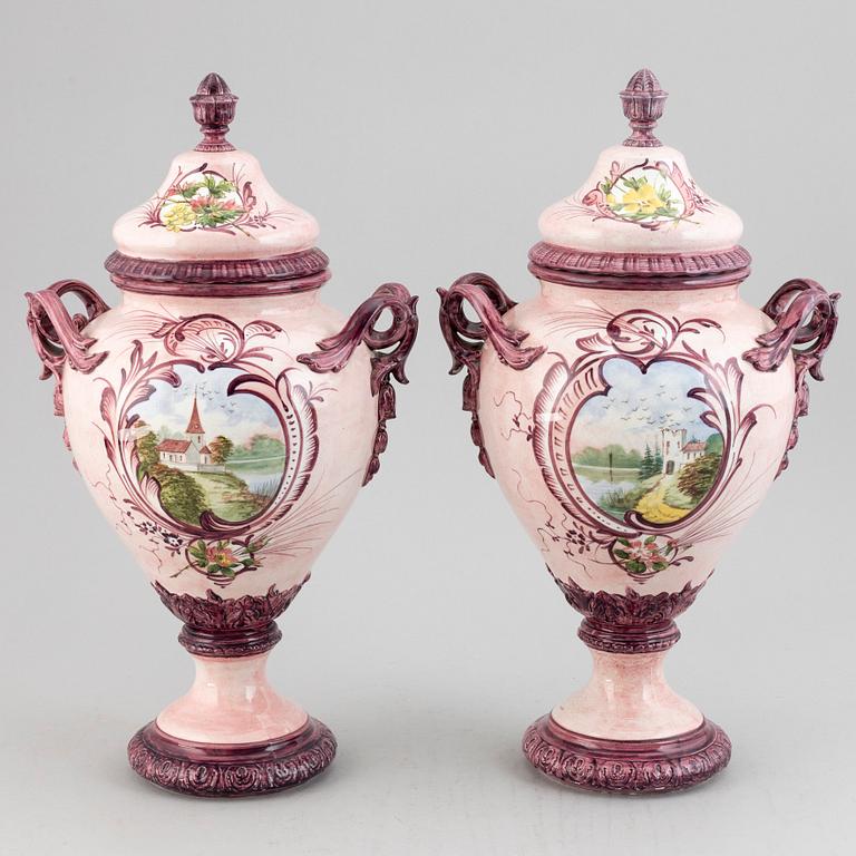 A pair of earthenware vases with covers, early 20th century.