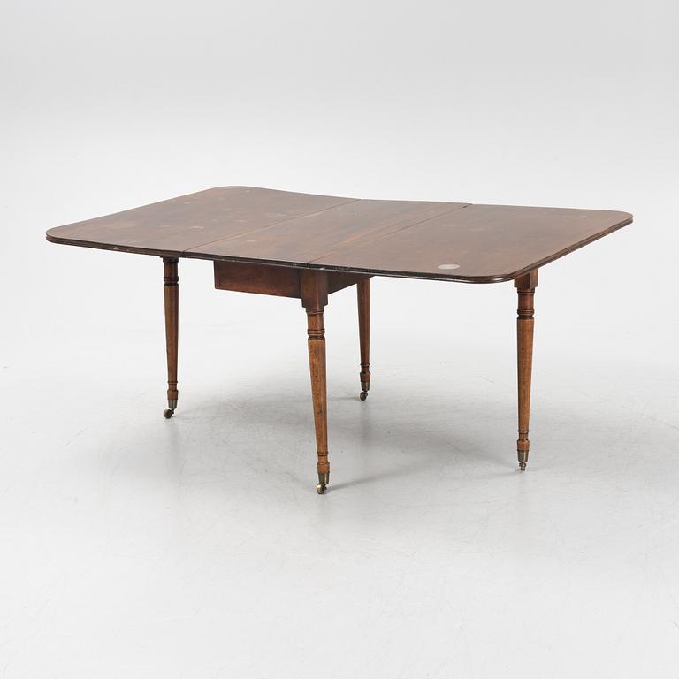 A mahogany dining table, second half of the 19th Century.