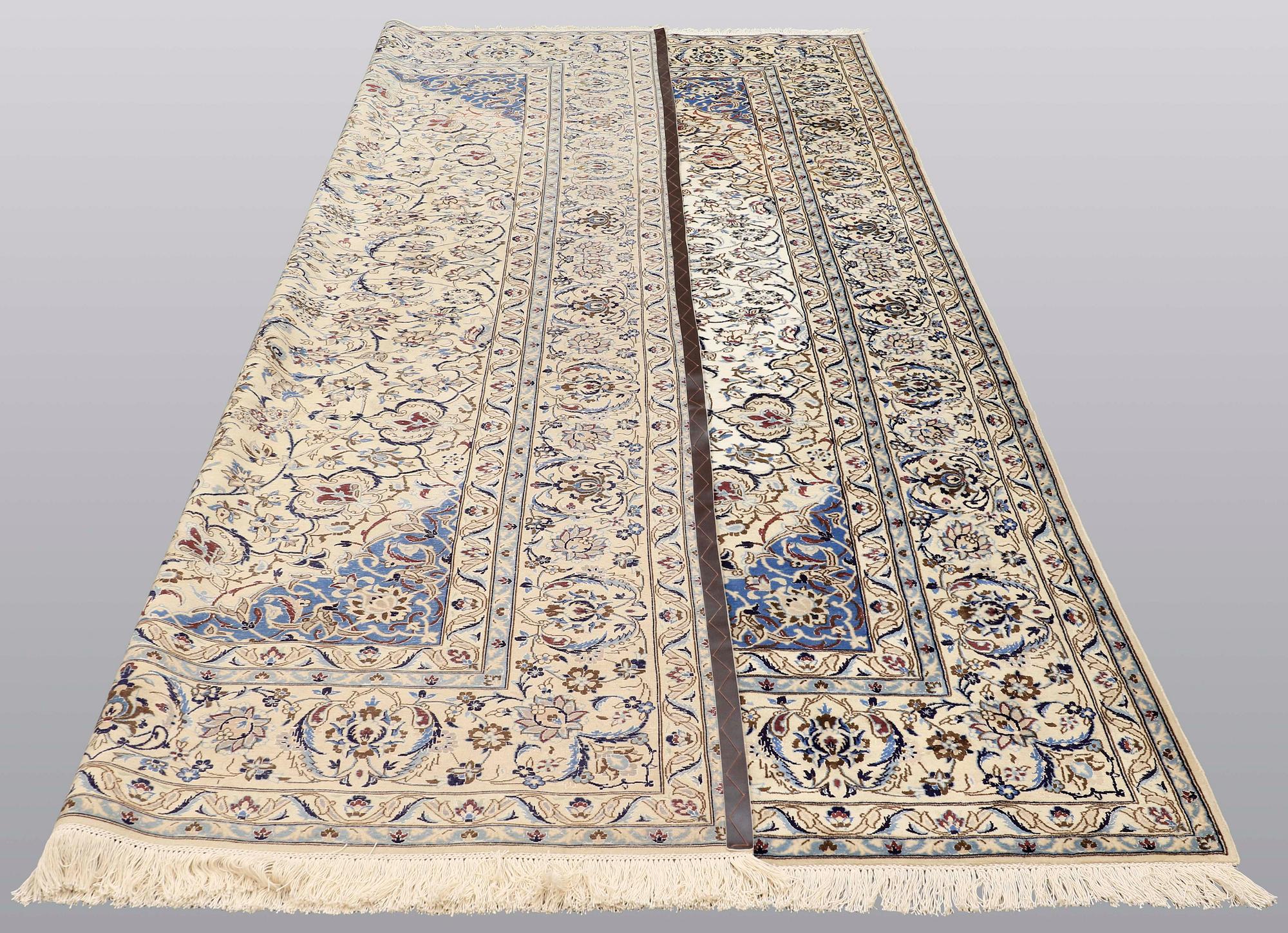 A carpet, Nain part silk, 364 x 256 cm.