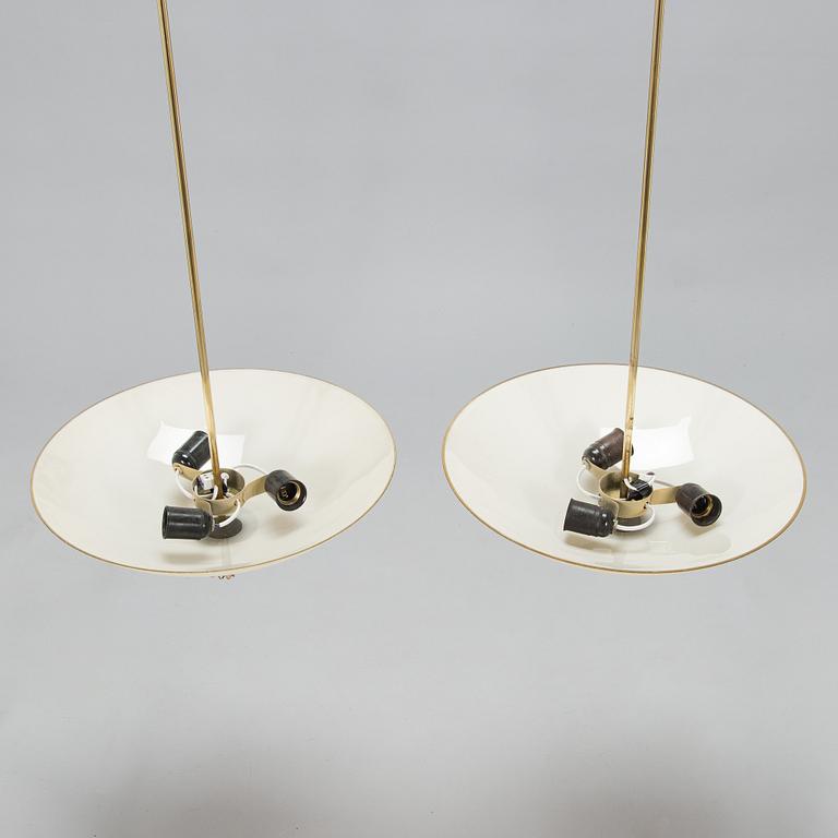 Paavo Tynell, a pair of mid-20th century pendant lights for Idman.