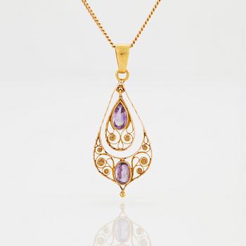 A PENDANT set with amethysts.