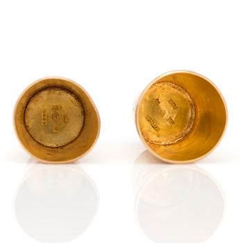 Two 18K gold thimbles with blue and lilac stones.