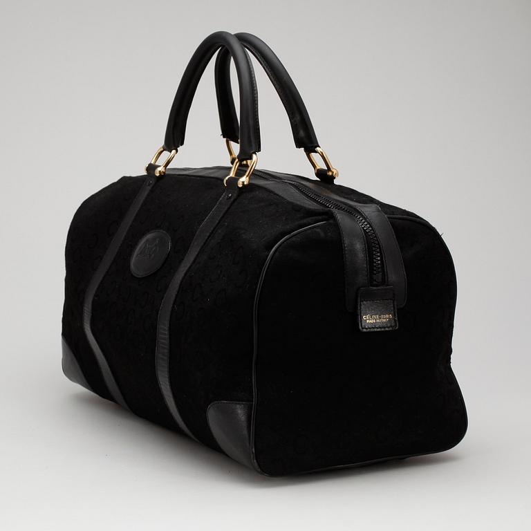 CÉLINE, a black canvas weekendbag.