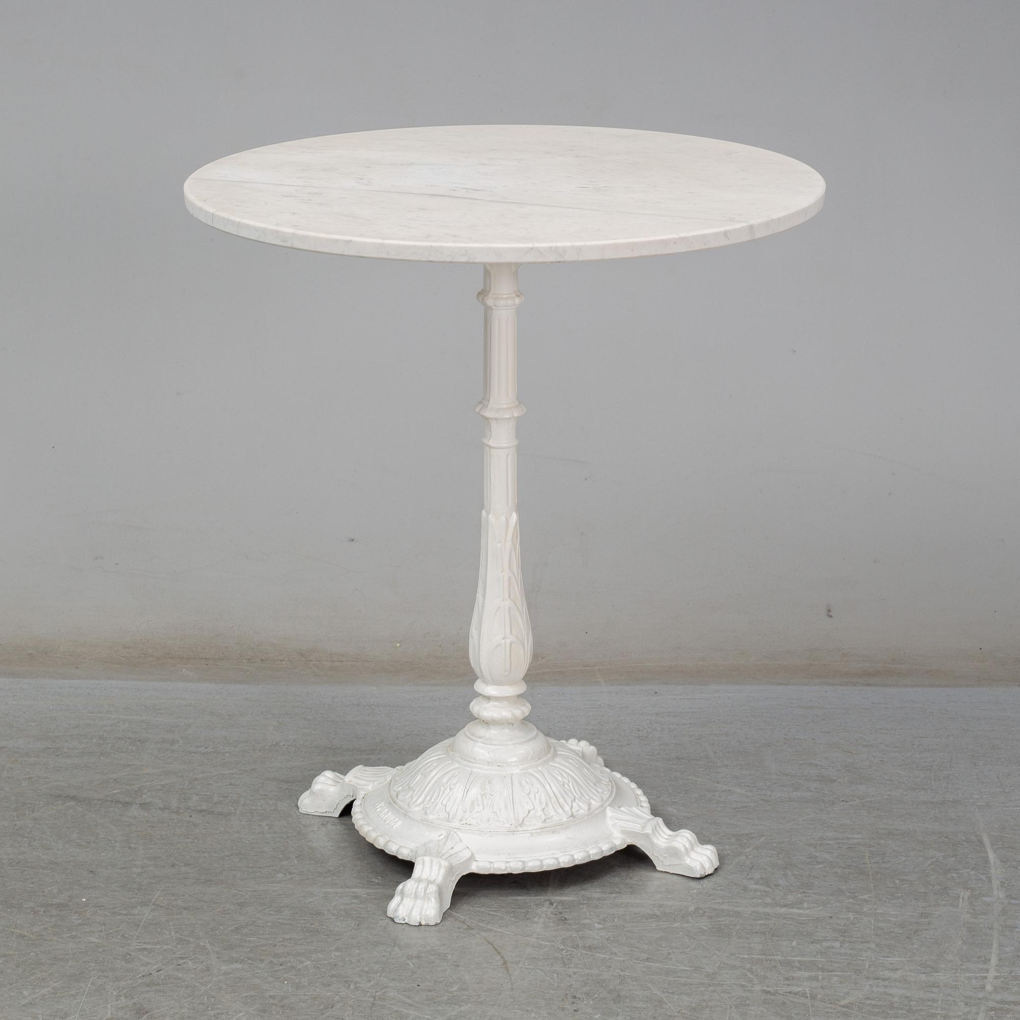 A cast iron and marble café table from Byarum.