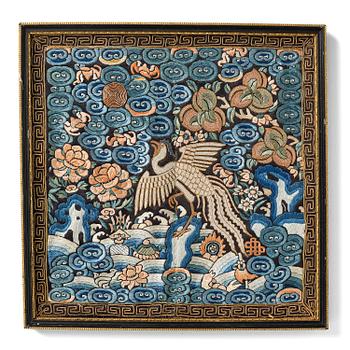 1135. An officals rank badge with a silver pheasant, Qing dynasty, early 19th century.