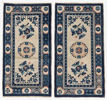 A pair of Baotou rugs, China, c. 120 x 64 cm.