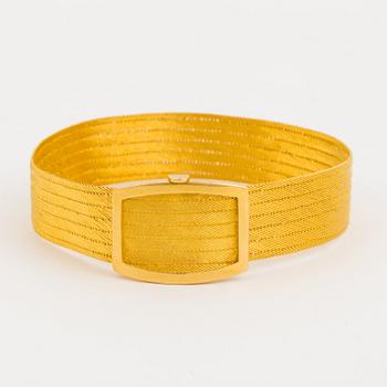 BRACELET, 18K gold shaped as a belt.